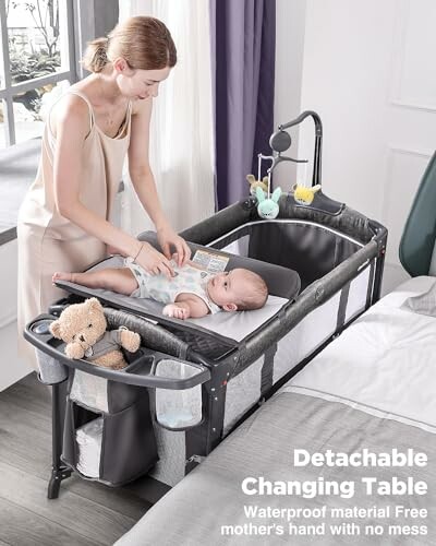 A mother using a detachable changing table with baby.