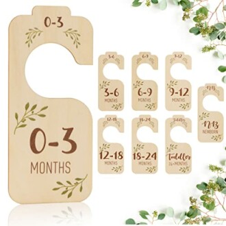 Wooden baby closet dividers for organizing clothes by age range from newborn to 24 months.