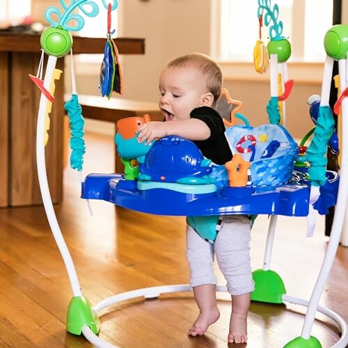 Baby playing in a colorful jumper toy