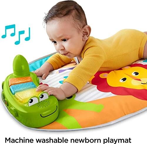 Baby on colorful playmat with musical toy