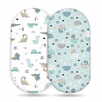 Two dinosaur-themed baby bedding sets in white and blue.