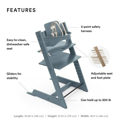 High chair with adjustable seat, foot plate, and safety harness.