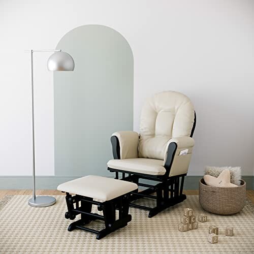 Nursery glider chair with ottoman, floor lamp, basket, and wall decor.