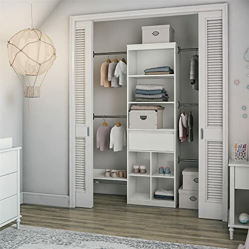 Organized closet with shelves, clothes, and storage boxes.