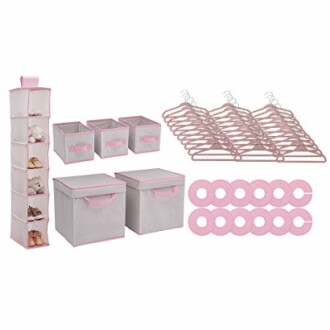 Pink nursery closet organizer set with storage bins, hangers, and dividers.