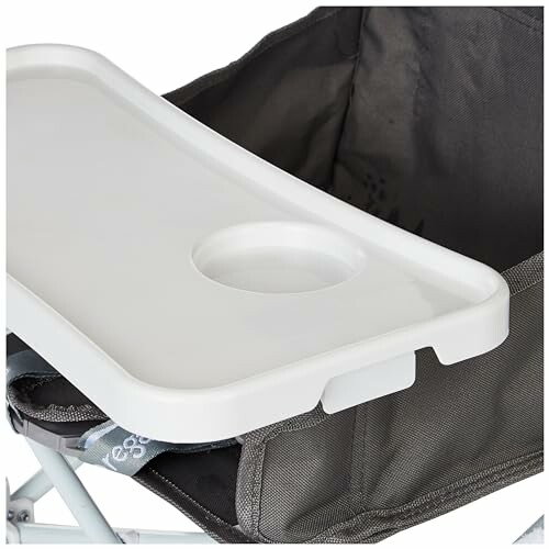 Portable high chair with attached tray and cup holder.