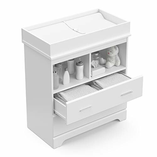 White changing table with open storage shelves and drawers