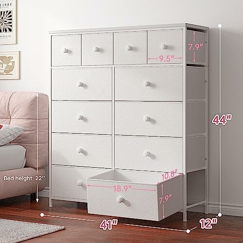 White dresser with multiple drawers and dimensions labeled.