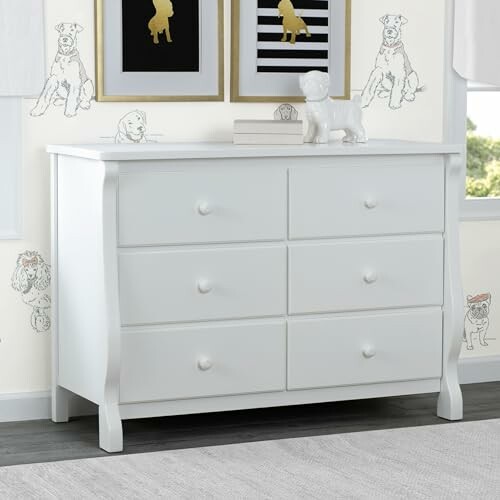 White dresser with dog-themed wall art and decor