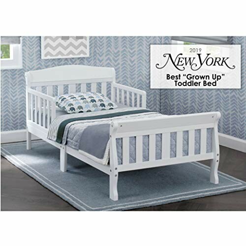 White toddler bed with bedding in a room, New York 2019 Best 'Grown Up' Toddler Bed award