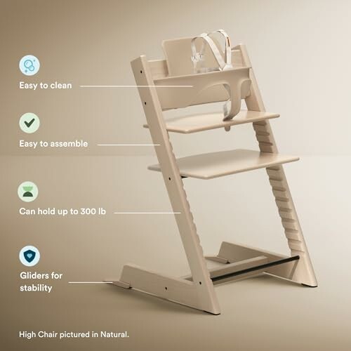 Wooden high chair with features labeled: easy to clean, easy to assemble, holds up to 300 lb, gliders for stability.